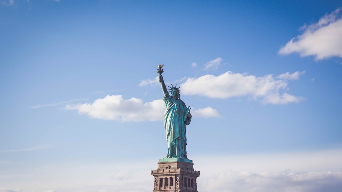 The Statue of Liberty against a clear blue sky